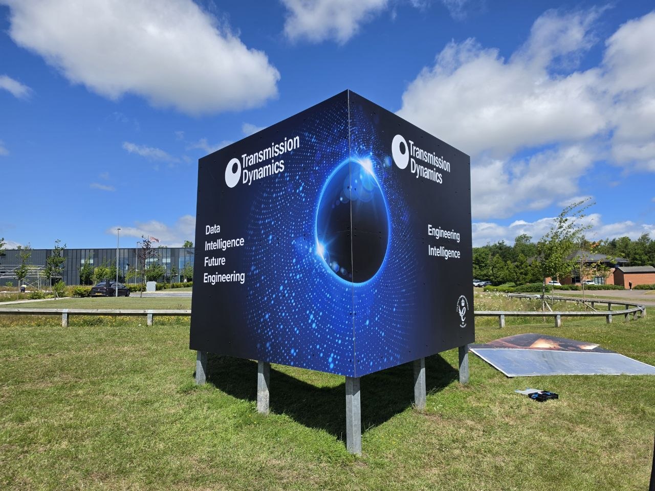 Transmission Dynamics freestanding cube sign